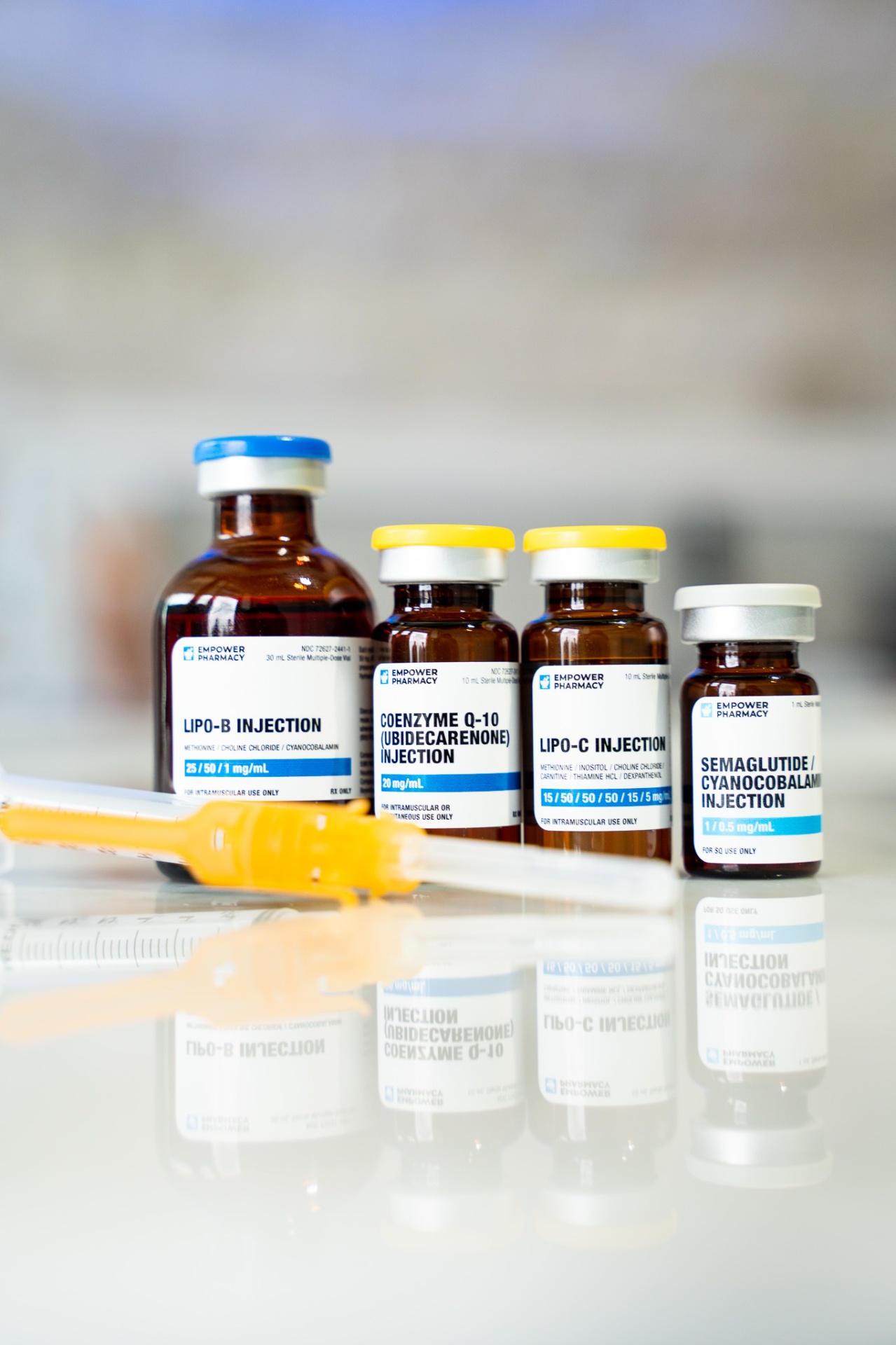 Medical-grade IM shot vials and syringes arranged on a tray at iCRYO Boca Raton