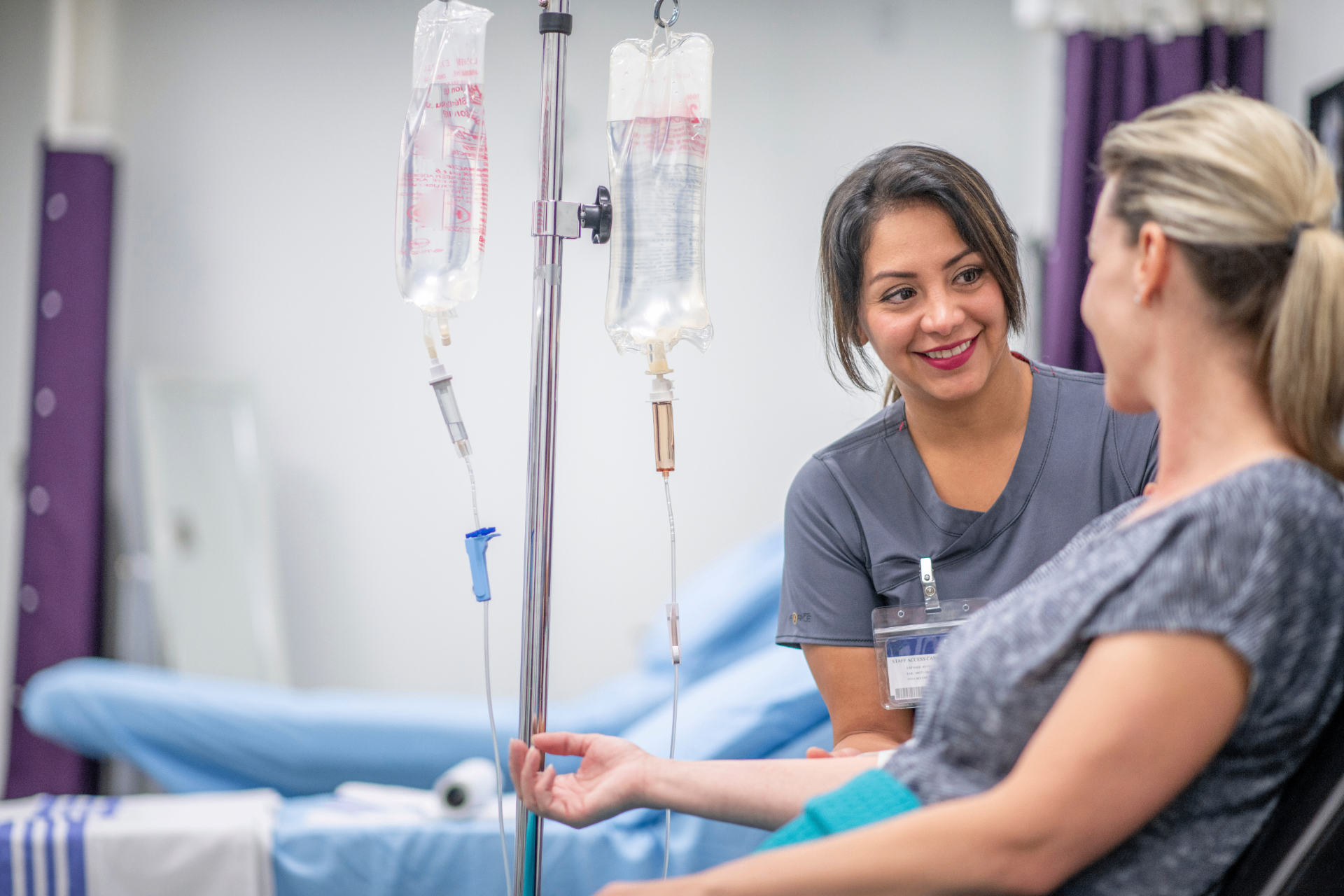 Licensed RN attending to a guest during a stem cell IV infusion at iCRYO Boca Raton