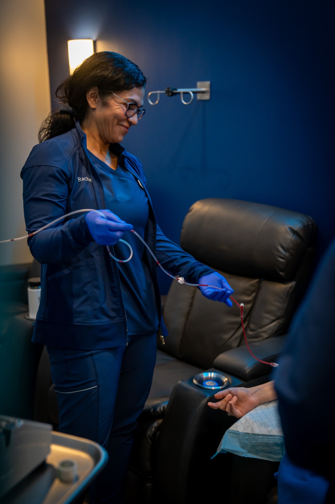 Licensed RN monitoring a guest during an Ozone UV IV session at iCRYO Boca Raton