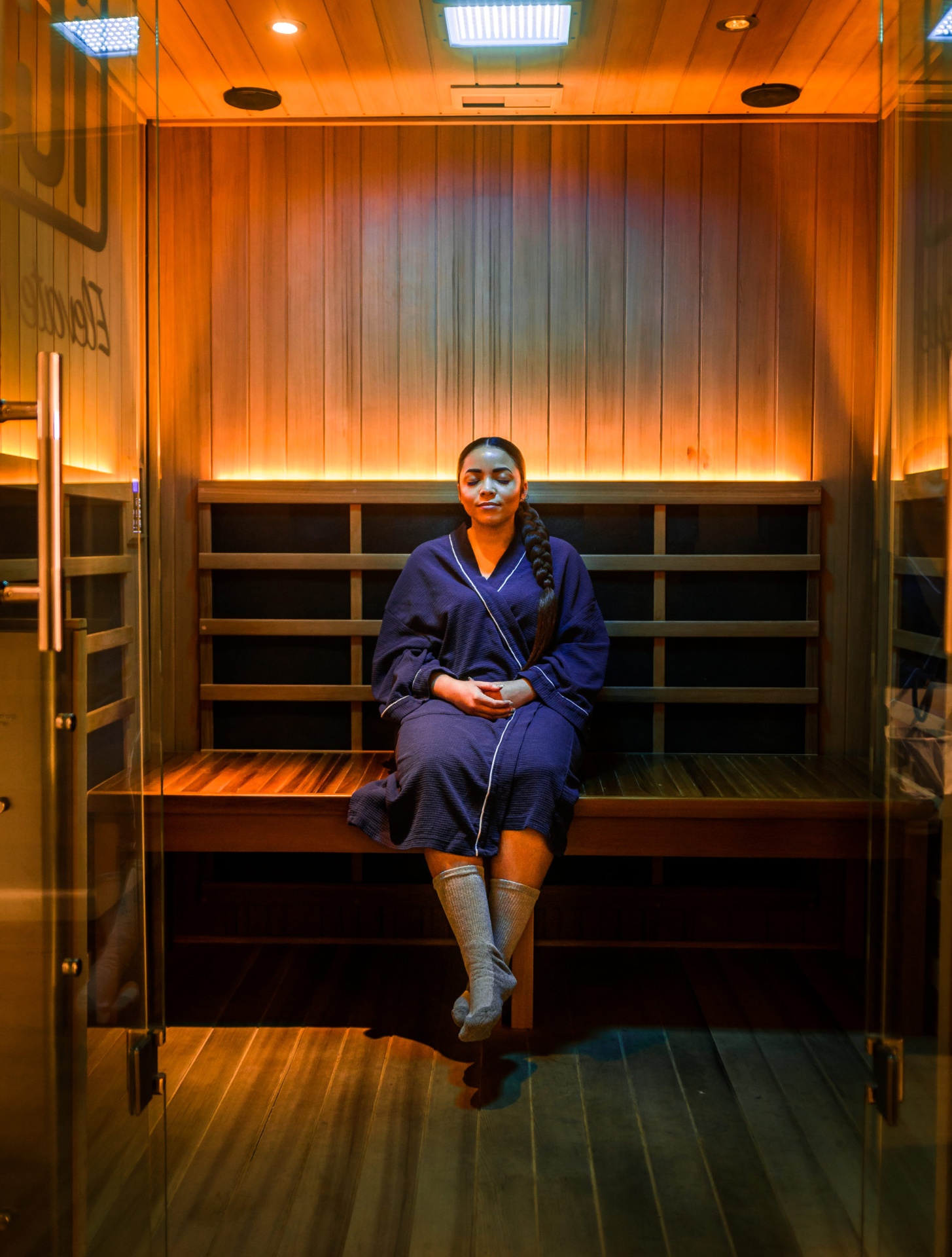 Guest sweating during a deep detox infrared sauna session at iCRYO Boca Raton