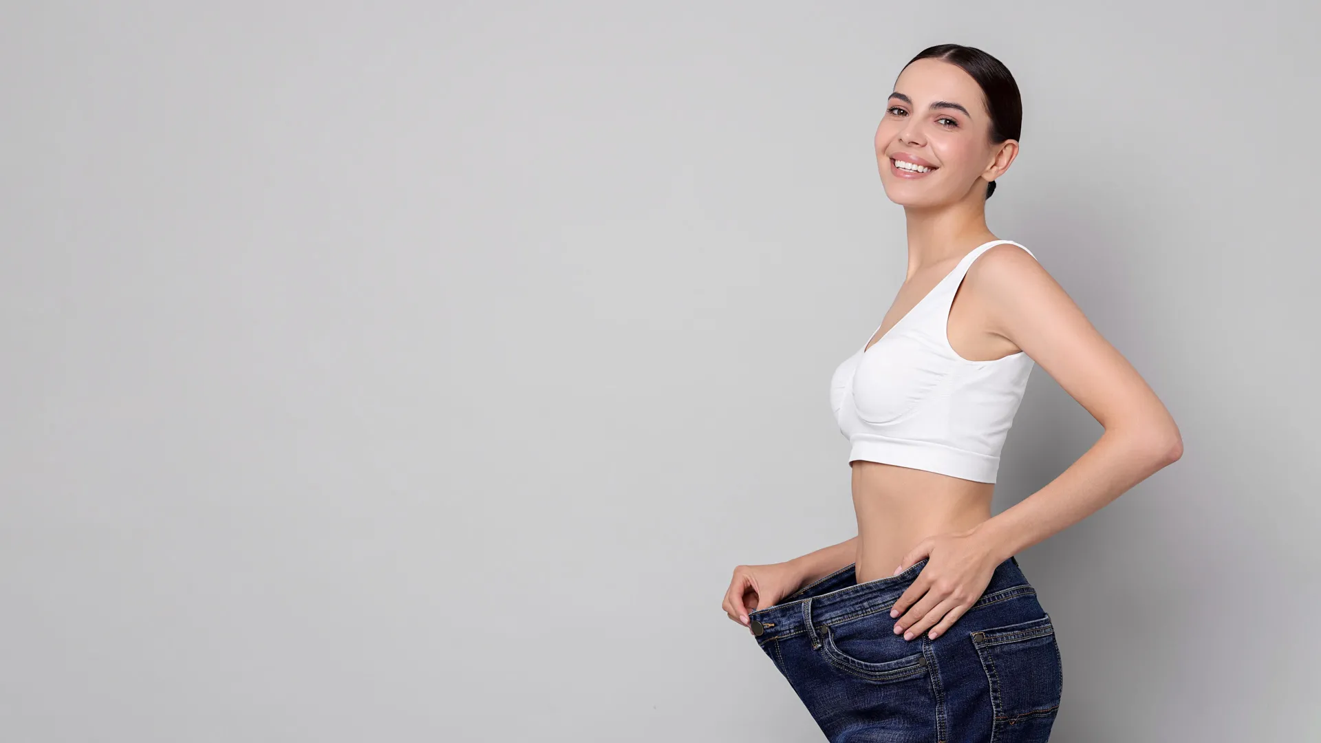 Woman celebrating weight loss results at iCRYO Boca Raton Medical Weight Loss program